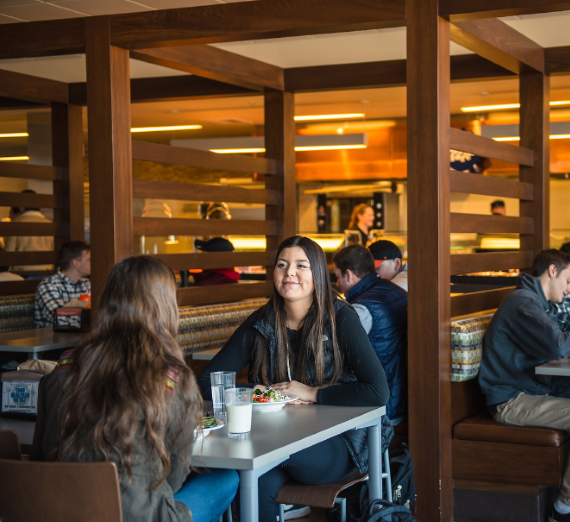 Man putting food into a brown paper bag